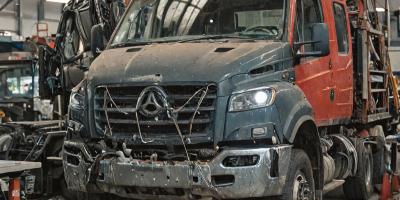 Professional truck collision repair assessment and safety procedures